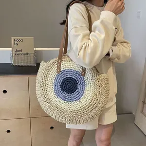 Stylish bohemian circular woven straw shoulder bag perfect for beach outings and casual wear