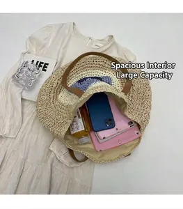 Close-up detail showing the spacious interior of this stylish woven straw beach bag.
