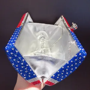 Interior detail of American flag rhinestone evening clutch with silver chain strap