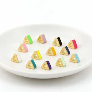 Detailed view of colorful triangular enamel beads for handmade DIY jewelry making