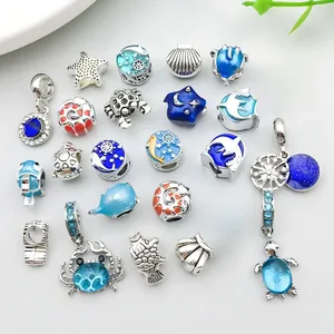 Detailed collection of ocean themed alloy charms with blue and orange enamel for DIY jewelry