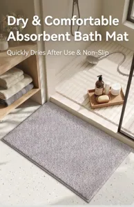 Soft grey plush bath mat placed at the entrance of a modern style bathroom shower