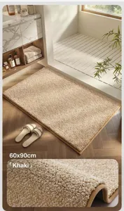 Close-up of thick khaki plush bath mat showing soft flocked texture and 60x90cm size