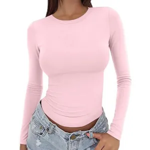 Slim fit pink long-sleeve crew neck T-shirt for women shown on a model with white background