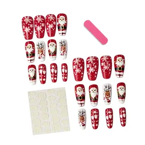 Set of 24 red Christmas press-on nails featuring Santa, reindeer and snowflake patterns
