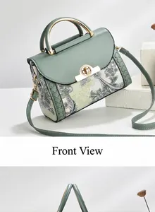 Front view of green vintage printed handbag featuring elegant gold hardware and floral pattern