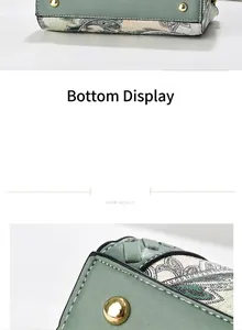 Close-up of sage green handbag details with vintage paisley pattern and gold rivets