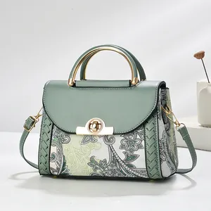 Elegant sage green splicing handbag with retro paisley print and gold hardware.