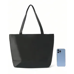 Black minimalist large capacity tote bag, classic solid color commuter shoulder handbag.