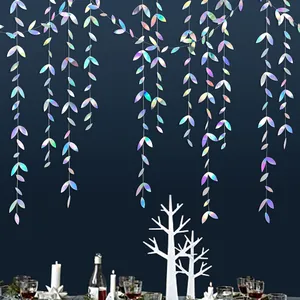 Detailed view of holographic leaf hanging paper garland creating festive party atmosphere.