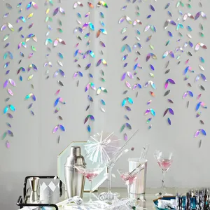 Hanging iridescent leaf garland backdrop detail for party wedding birthday celebration decor.