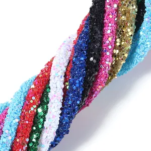 Close-up of vibrant colorful sequin PVC rhinestone braided cord for DIY hair accessories.