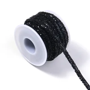 Detailed view of black rhinestone cord spooling, ideal for clothing and DIY crafts.