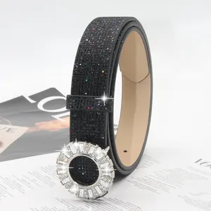 Women's black rhinestone belt with sparkly crystal round buckle, fashion waist accessory.