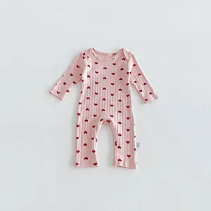 Pink ribbed baby romper with red hearts, cute long sleeve newborn jumpsuit for infant girls.