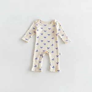 Cute infant baby long sleeve romper, soft ribbed cotton material with sweet blue bow prints.