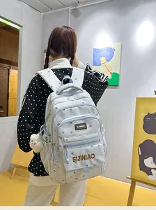 Zaino scolastico azzurro con motivo a stelle, vari scomparti con cerniera e grazioso peluche.