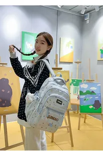 Elegante zaino scolastico per studenti con stampa di stelle e ciondolo di peluche.
