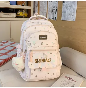 Zaino scolastico rosa con stampa di stelle per ragazze, grande zaino casual con ciondolo in peluche.