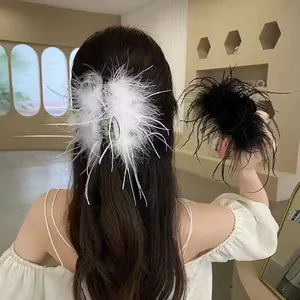 Elegant ostrich feather hair claw clip for women in black and white minimalist style