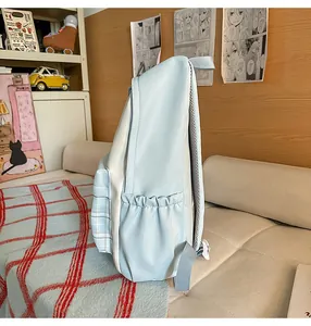 Detailed side view of cute Japanese ins style light blue plaid school backpack for girls teens.