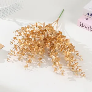 Gouden kunstmatige eucalyptus bladeren takken voor huisdecoratie huwelijk bloemen