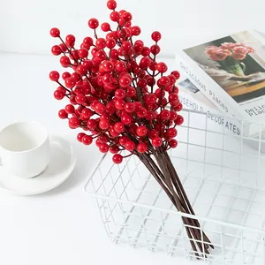 Artificial red berry branches for home decor, vibrant fake holly fruits for New Year arrangement.