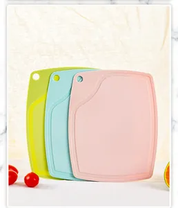 Set of three colorful PP plastic cutting boards with juice grooves and hanging holes