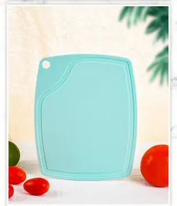 Detailed front view of a thickened food-grade PP plastic cutting board in mint green