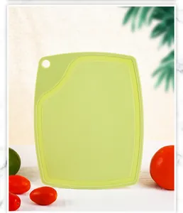 Light green food-grade PP plastic cutting board with hanging hole for kitchen use