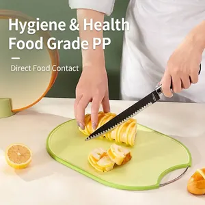 Professional food-grade green plastic cutting board set for slicing fruits and bread