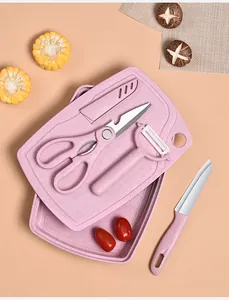Detailed view of pink 5-piece baby food prep set with cutting board, knife and peeler