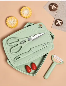 Detailed top view of a 5-piece green baby food supplement cutting board and knife set