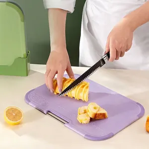 Purple double-sided baby cutting board made of food-grade PP with scale markings.