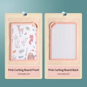 Double-sided pink plastic cutting board featuring cute cartoon animal patterns for kitchen