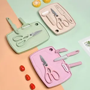 Colorful 5-piece baby food cutting board set including scissors, peeler, and knife