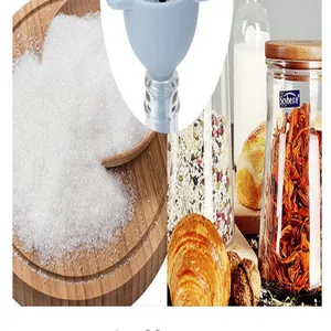 Close-up view of blue multifunctional funnel filtering white sugar in a kitchen.