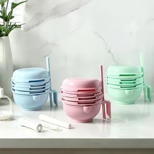 Manual baby food grinder set for fruit puree including bowls and pestles in pastel colors