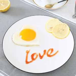 Heart-shaped stainless steel fried egg mold with perfect egg on plate for breakfast DIY