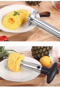 Detailed view of a stainless steel pineapple corer slicer tool cutting fruit rings