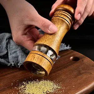 High-quality manual oak wood pepper grinder featuring ceramic core and acrylic window view