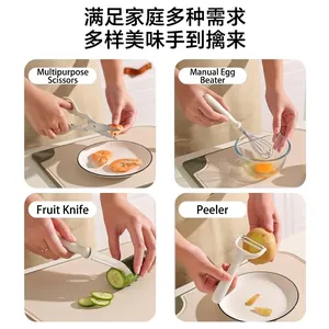 Versatile 4-piece kitchen tool set including scissors, whisk, peeler and fruit knife