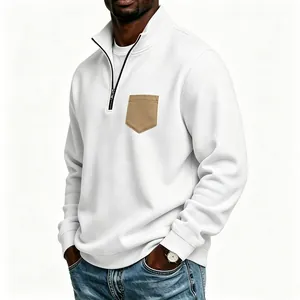 Detailed view of men's white half-zip sweatshirt with a contrasting tan chest pocket.