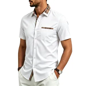 Detailed view of men's short-sleeve shirt featuring plaid contrast collar and pocket.