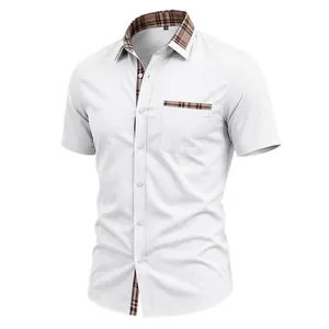 Detail view of men's white short-sleeve shirt with plaid contrast collar and pocket