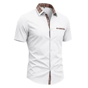 Detail view of a men's white short sleeve shirt with plaid collar and pocket trim