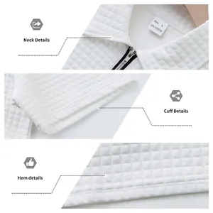 Gros plan détaillé du tissu jacquard blanc, du col à zip, des poignets et de l'ourlet.