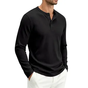 Close-up detail of black waffle knit Henley long sleeve shirt with classic button neckline