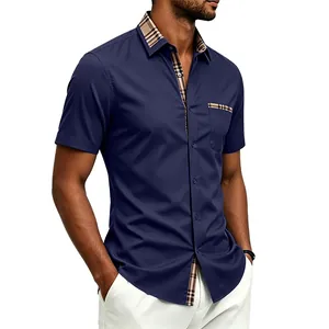 Detailed macro view of men's navy blue shirt with plaid contrast collar and pocket
