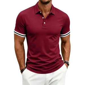 Detail view of men's burgundy polo shirt with white buttons and striped cuffs